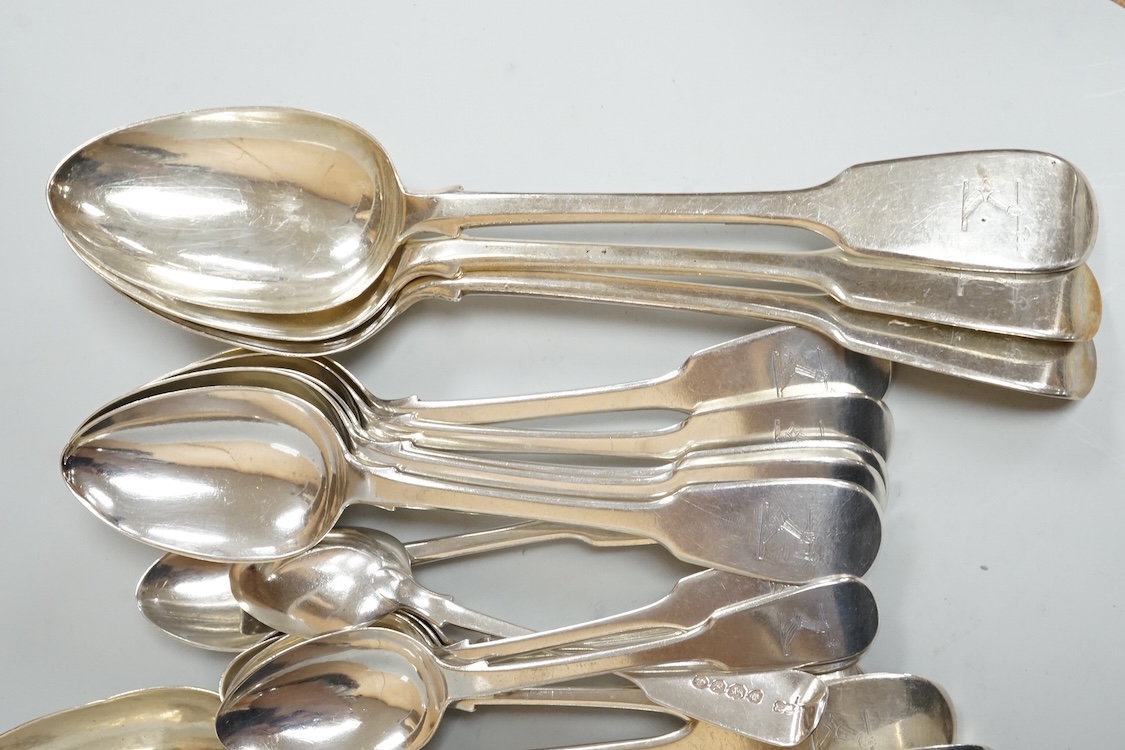 A harlequin part canteen of 19th century silver fiddle pattern flatware, comprising twenty six items, all with engraved crest various dates and makers, 32.3oz.